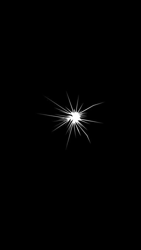 A black and white starburst on a black background